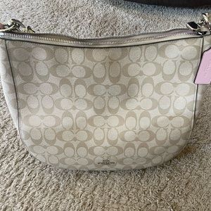 Pink and tan leather Coach purse.